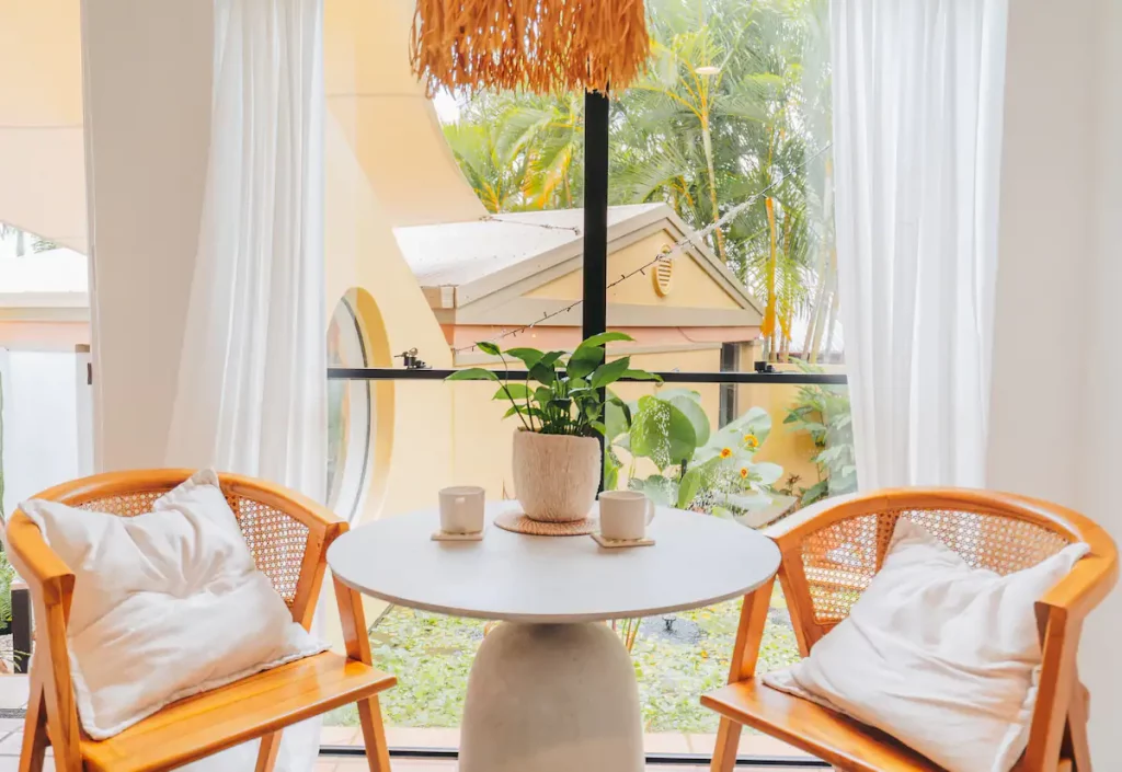 Two rattan chairs sitting next to each other