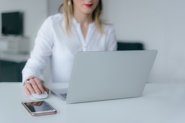 woman searching on her computer for property listings